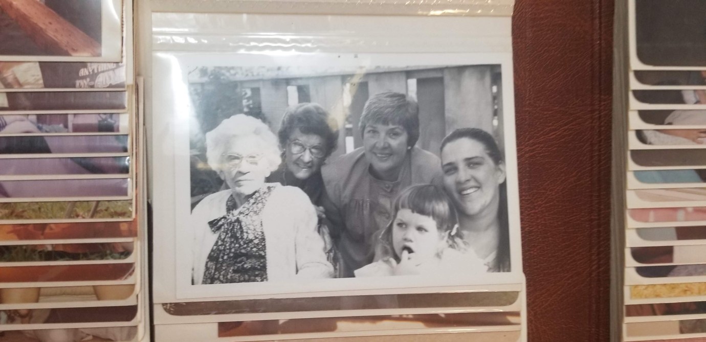 black and white photo of 5 people in age order- very elderly woman/great-great-grandmother, senior woman/great grandmother, late middle-age woman/grandmother, young adult woman/mother, child of 2 or 3 years/daughter.